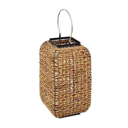 The Novogratz 20&#x22; Brown Dried Plant Handmade Rattan Weaved Candle Lantern with Glass Holder and Handle